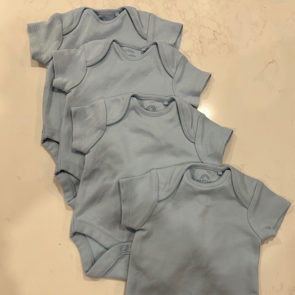 4 pack Next Onesies